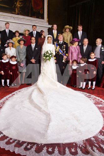 With glamorous details such as satin gloves and a fur trim, the Spanish couturist made sure to create a look that went down in royal bridal history