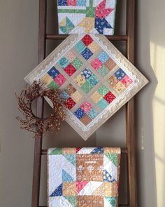 The drying rack leaning against a wall makes a perfect place to drape a few  quilts