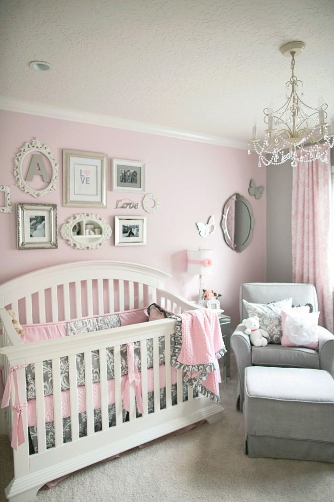 This timeless toddler girls bedroom features lovely white and purple flower  wall decorations and a matching gingham bedspread