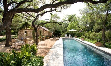 Modern backyard swimming pool with hot tub