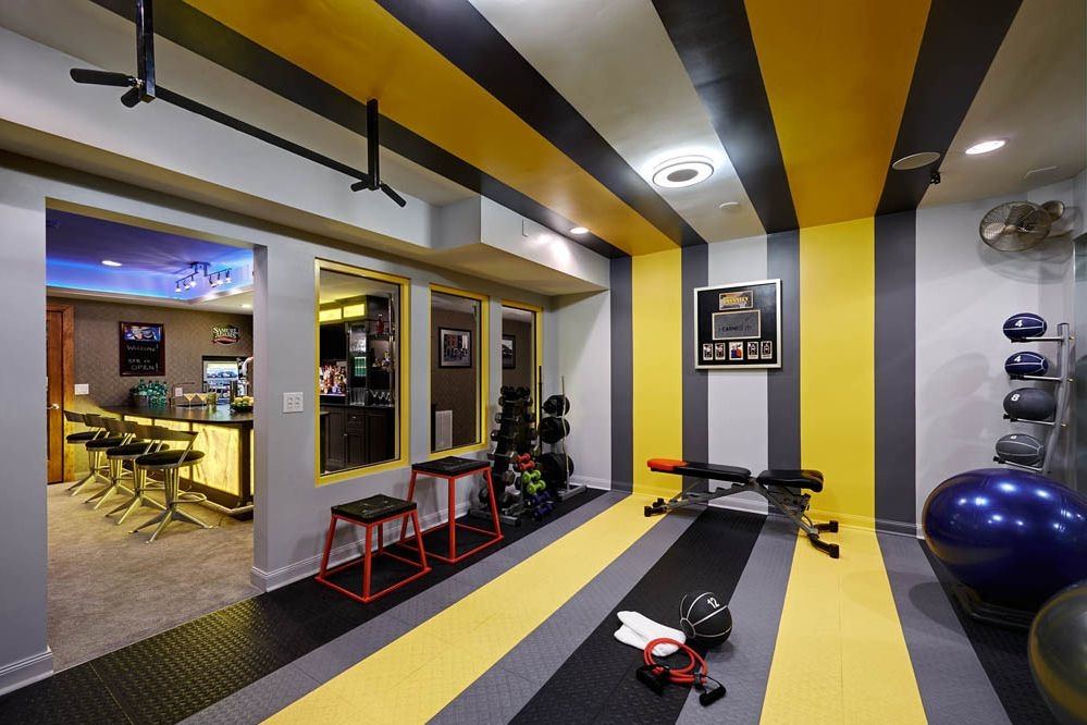 Fitness room with weights on shelves