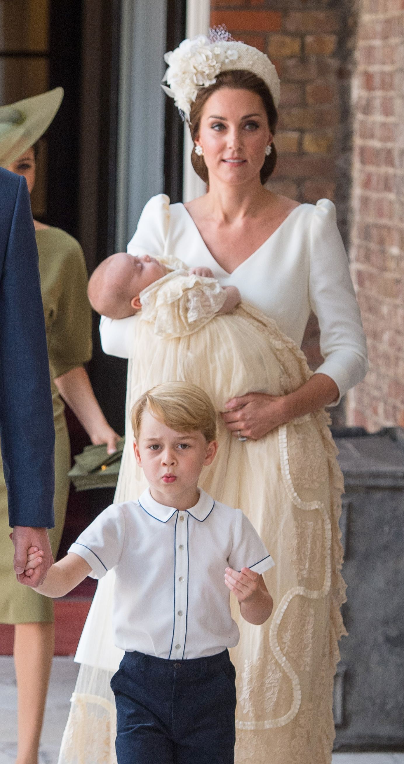 LONDON, ENGLAND – JULY 09: Princess Charlotte and Prince George hold the  hands of their father, Prince William, Duke of Cambridge, as they arrive at  the