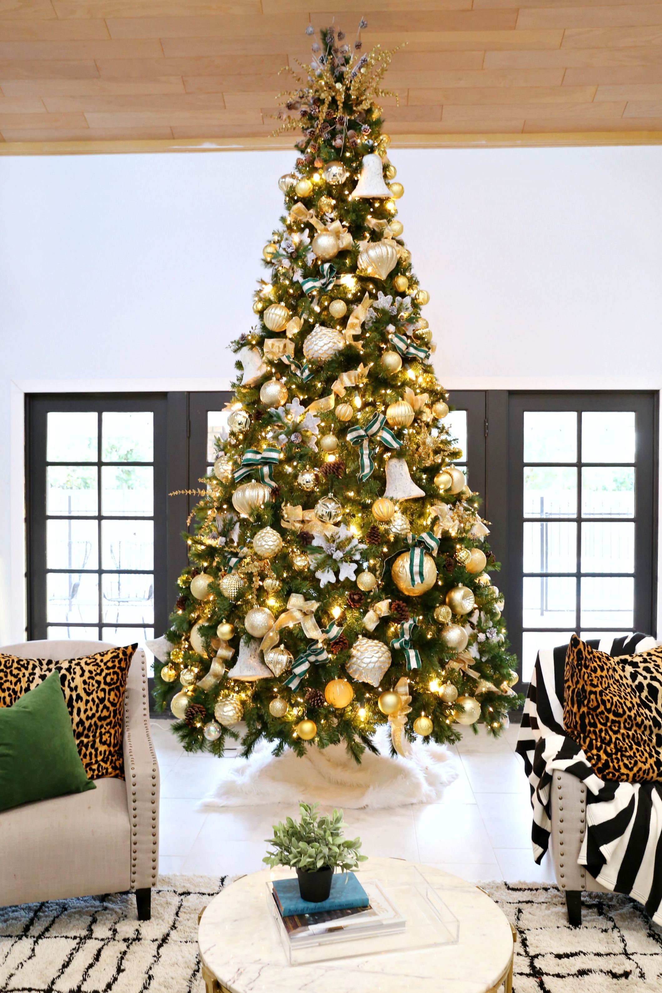 This elegant Christmas tree beautifully mixes oversize ornaments  with