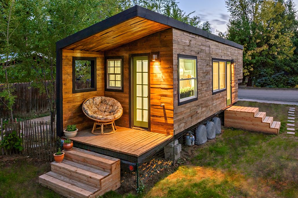 What's really interesting about this tiny house's design, is that the  solution to making it more family friendly seems to come, not from adding  more,