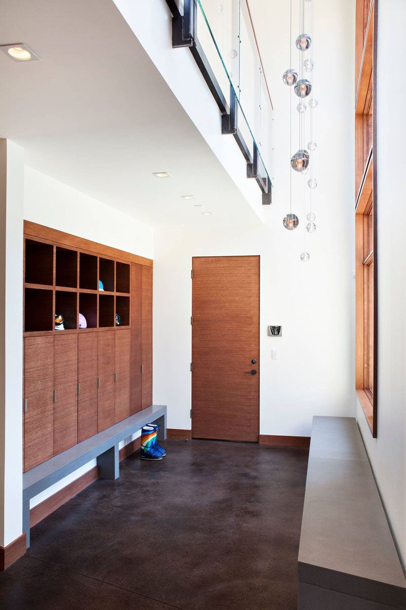 White Entry Way Storage with Shelves Drawers Hanging Hooks and Wicker Baskets