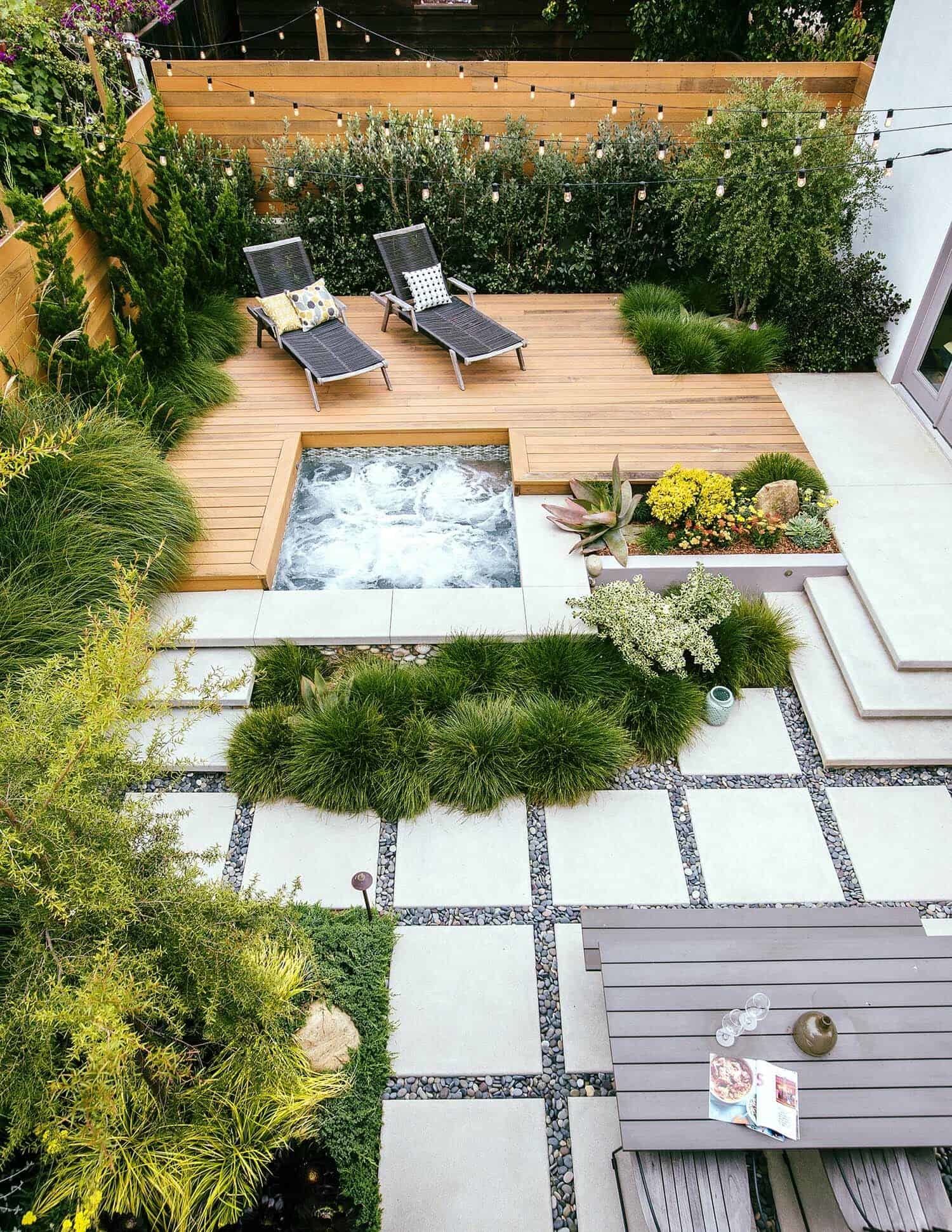 This backyard was made for relaxation, from the redwood deck and hot tub to the lush foilage that creates a tropical oasis