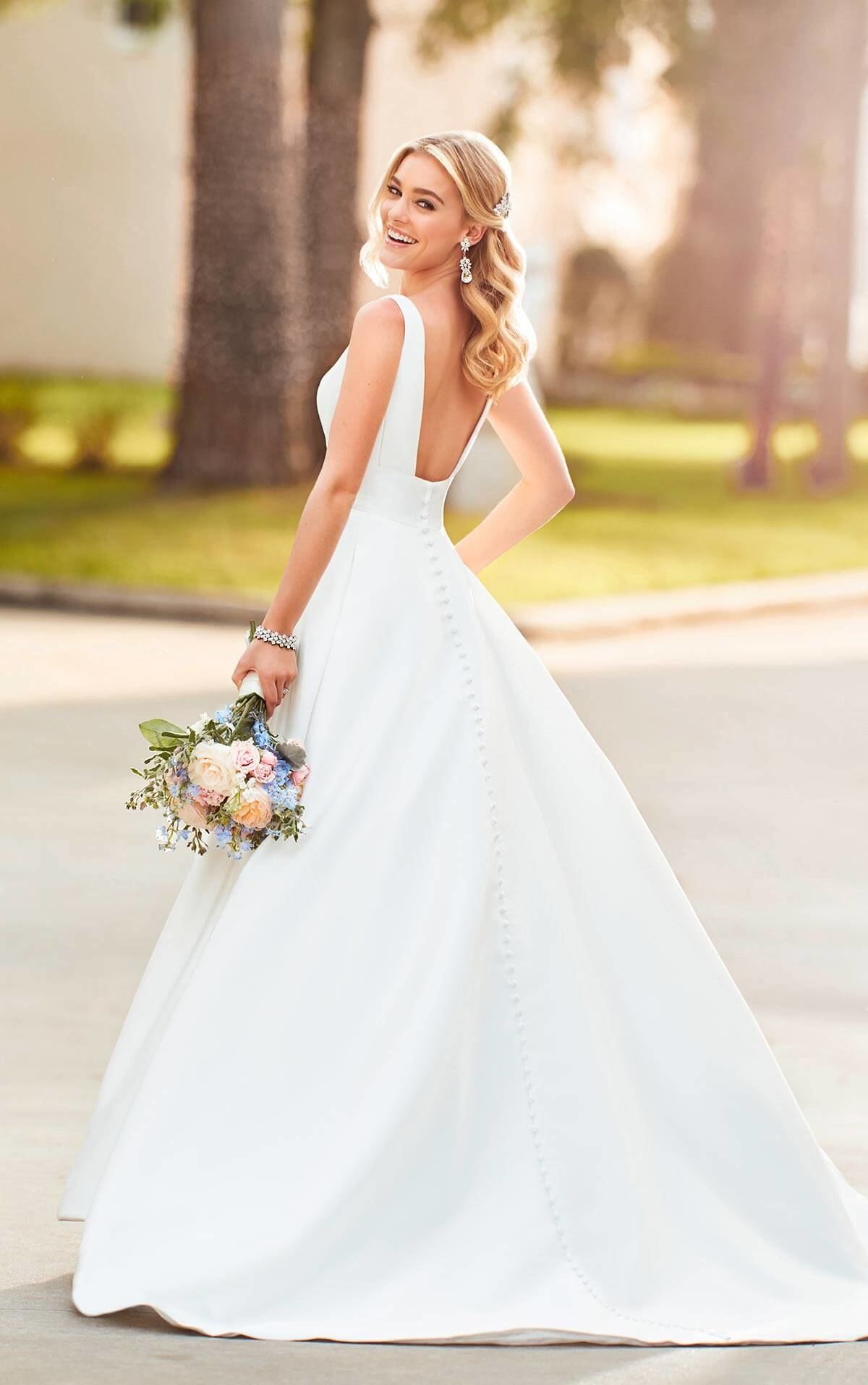 Model wearing D2503 Simple and Sexy Wedding Dress by Essense of  Australia